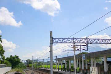 Taiwan May 21, 2024: A scenic view of a train at Fuli Station in Hualien, Taiwan, with clear sky and mountain background. Ideal for travel, transport, and rural tourism themes. Fuli Station