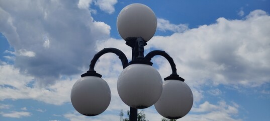 street lanterns on blue sky