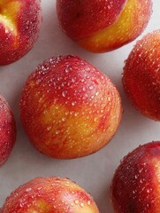 Fresh, vibrant peaches with water droplets