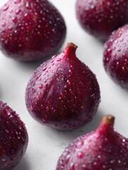 Fresh, vibrant figs with water droplets, arranged on a clean white surface, highlighting their unique shape and texture. --ar 3:4 --profile uv8egwy --v 7 Job ID: 754e246f-4614-4868-b6ca-7767f2d83d71