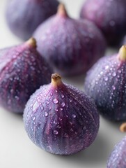 Fresh, vibrant figs with water droplets