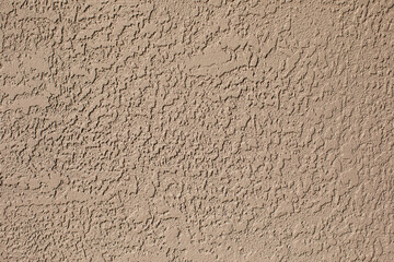 Light Brown Wall Textured Stucco Paint on a building