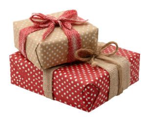 Two gift boxes, one beige with white polka dots and red ribbon, stacked atop a red polka dot box with burlap twine