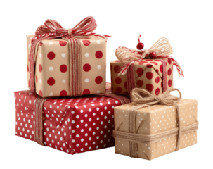 A stack of festively wrapped gifts with red polka dots on beige paper, tied with twine and ribbons
