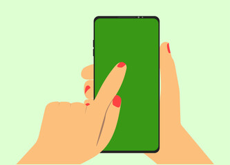 female hand holding smart mobile phone with blank green screen on blue background
