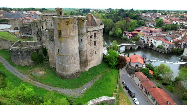 Cinematic Aerial of Chateau de Clisson Ruins: Medieval Italianate Town in Loire-Atlantique, France. Historical Fortress , village and  River View, 4K Drone