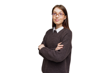 Young professional confidently posing with arms crossed while wearing stylish glasses in a cozy office setting