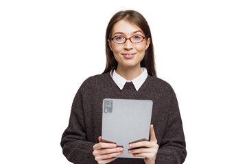 Smiling woman in a cozy sweater holds a tablet while showcasing a cheerful expression indoors