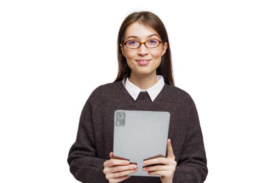 Smiling woman in a cozy sweater holds a tablet while showcasing a cheerful expression indoors