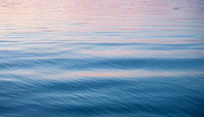 Naklejka premium tranquil water surface with ethereal gradient soft hues and gentle ripples for calm atmosphere