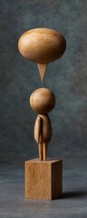 This captivating wooden sculpture features a simplified figure standing on a cube, symbolizing contemplation and expression through minimalist design and natural materials.
