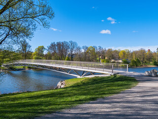 Modern Pedestrian Bridge Over Calm River