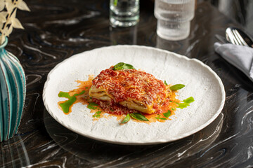 Portion of gourmet italian lasagna bolognese dish