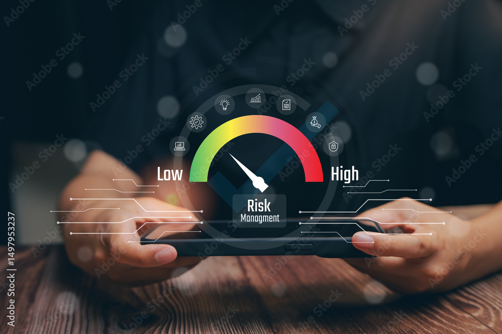 Poster risk management meter on smartphone screen showing low to high levels of risk in business context