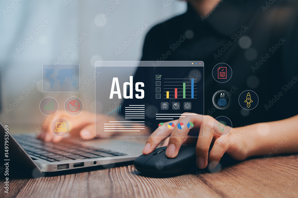 Poster hands on laptop mouse with digital ads interface and graphics in modern office setting