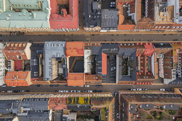 Drone aerial view of a historic city center featuring charming courtyards, cozy residential areas,...