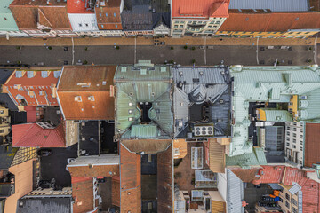 Drone aerial view of a historic city center featuring charming courtyards, cozy residential areas,...