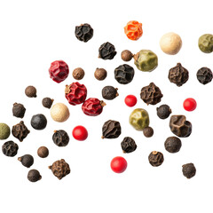 A close up shot of various colored peppercorns scattered on a black background in a studio setting