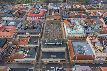 Drone aerial view of a historic city center featuring charming courtyards, cozy residential areas,...