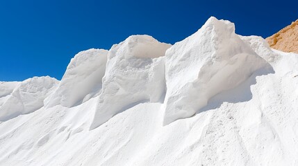 White Salt Pile Under Bright Blue Sky