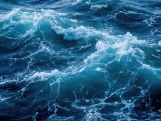 Pure blue turquoise water texture of the ocean sea with foam from and waves
