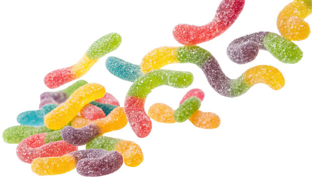 A scattered pile of colorful sour gummy worms candy with a sugar coating on a black background image