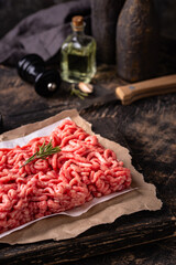 Raw minced meat on dark background