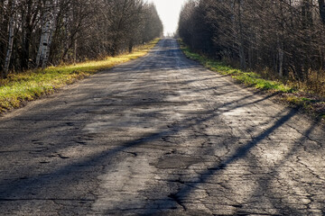 A straight road in the countryside. A road trip.