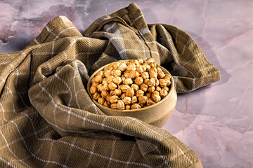 Bowl of chickpeas on rustic cloth