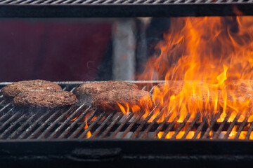 Flames meet flavor – burgers grilled to perfection.