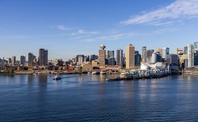 Fototapeta premium Scenic Skyline of Downtown Vancouver with Waterfront and Clear Blue Sky