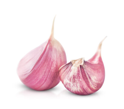two pink garlic cloves isolated on a white background