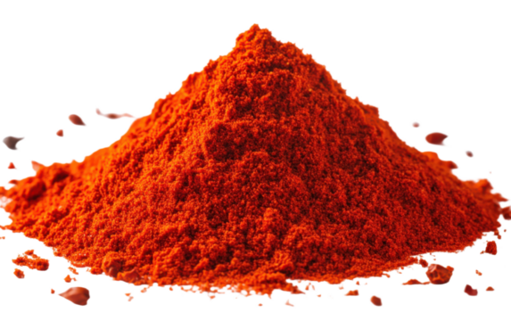 Pile of red pepper flakes on a white background