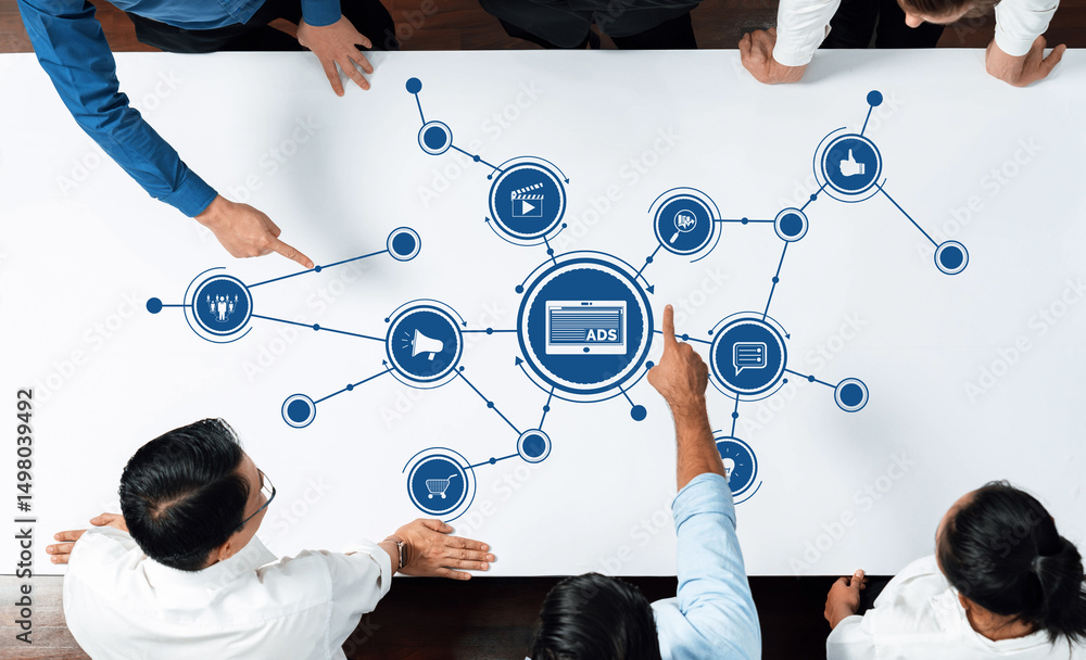 Aufkleber a diverse team collaborates in a meeting, pointing at graphical advertising concepts on a table, sho