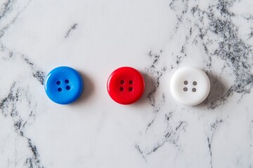 Vibrant Blue, Red, and White Buttons Arranged on a Marble Surface A Close-Up Stock Photo Ideal for Crafts, Fashion, and Design Projects.