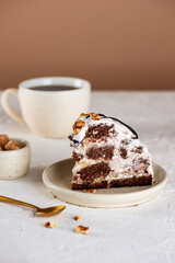 Piece of Pancho cake with pineapple and vegan sour cream topped with chocolate biscuit and walnut and cup of chicory drink. Sugar, lactose and gluten free. Vertical orientation.