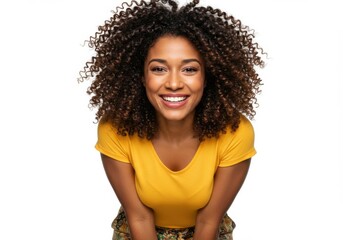Happy young woman with curly hair smiling broadly at the camera