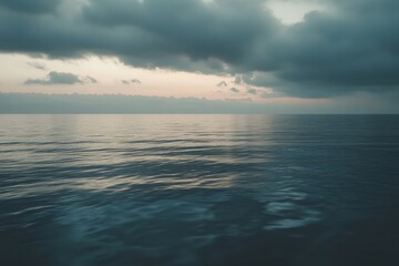 Obraz premium Cloudy seascape with calm waters and soft hues at dusk, cloudy on sea landscape Photo in background