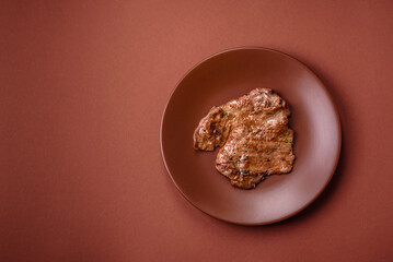 Steak, grilled beef, sirloin cooked on the barbecue with salt and spices