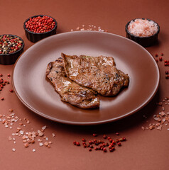 Steak, grilled beef, sirloin cooked on the barbecue with salt and spices