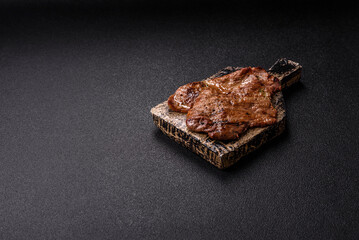 Steak, grilled beef, sirloin cooked on the barbecue with salt and spices