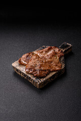 Steak, grilled beef, sirloin cooked on the barbecue with salt and spices