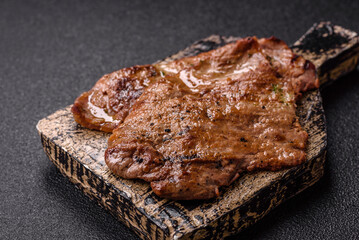 Steak, grilled beef, sirloin cooked on the barbecue with salt and spices