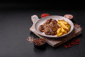 Steak, grilled beef, sirloin cooked on the barbecue with salt and spices