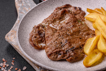 Steak, grilled beef, sirloin cooked on the barbecue with salt and spices