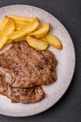Steak, grilled beef, sirloin cooked on the barbecue with salt and spices
