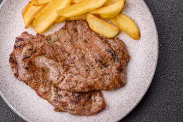 Steak, grilled beef, sirloin cooked on the barbecue with salt and spices