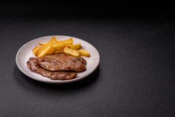 Steak, grilled beef, sirloin cooked on the barbecue with salt and spices