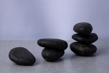 Balanced stones create a calm arrangement on a smooth surface in neutral tones