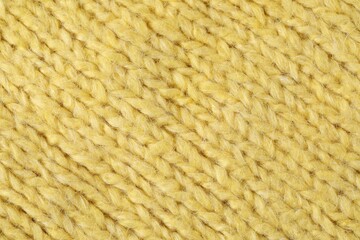 Texture of yellow wool fabric as background, top view